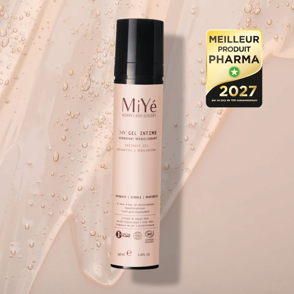Tube airless de gel intime hydratant rééquilibrant sur fond de texture gel avec le macaron de meilleur produit pharma 2027