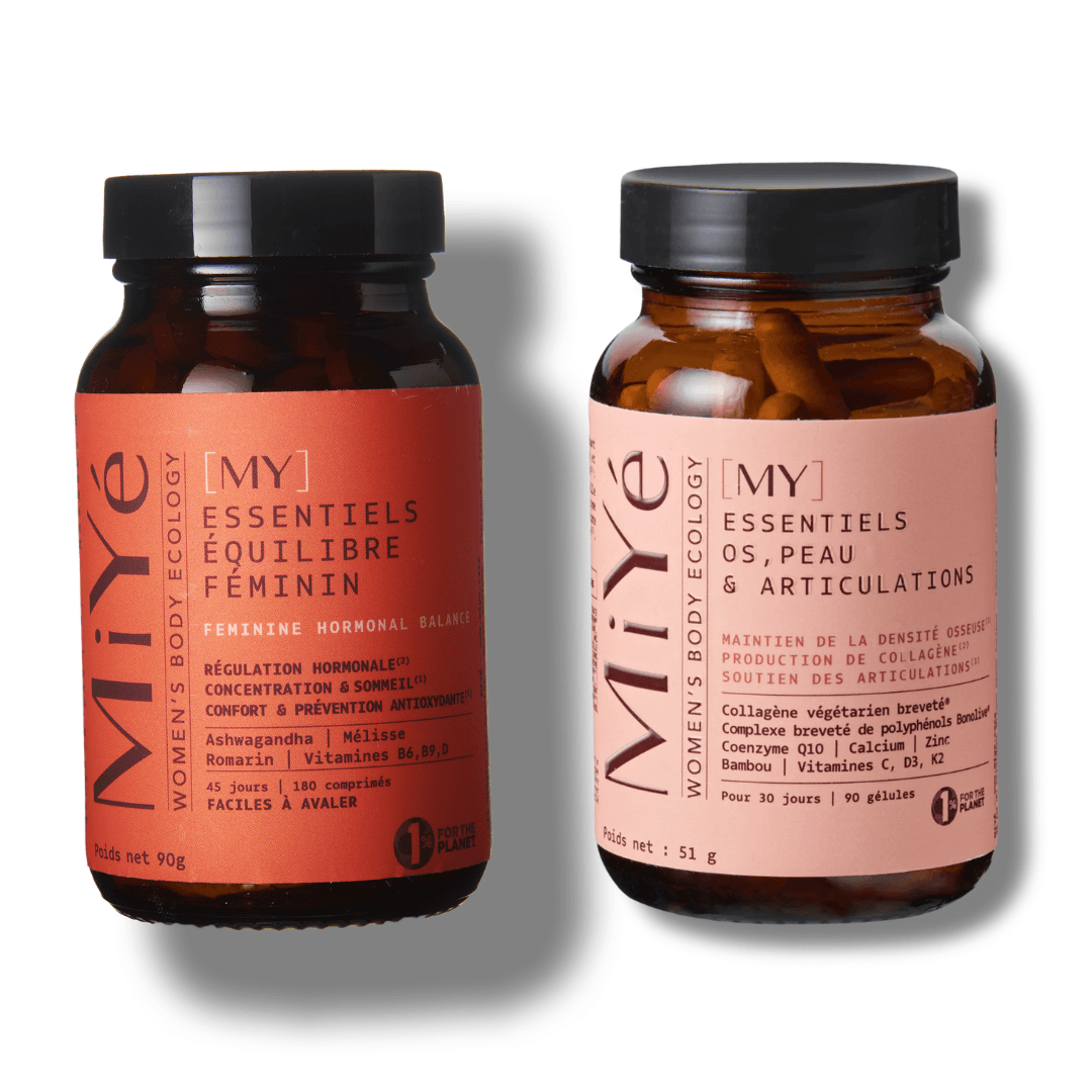 Deux piluliers en verre, le premier contenant [MY] Essentiels équilibre féminins et le second [MY] Essentiels Os, Peau et articulations